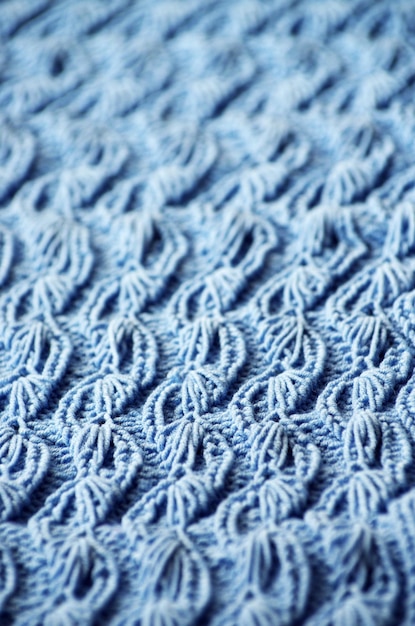 La texture d'un tissu de laine tricoté bleu