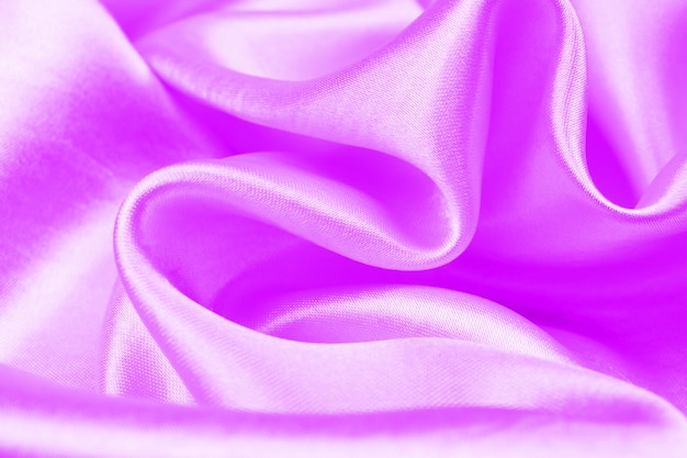 Texture de tissu de luxe satin violet peut utiliser comme fond de mariage, Backgroound de soie pourpre élégant lisse