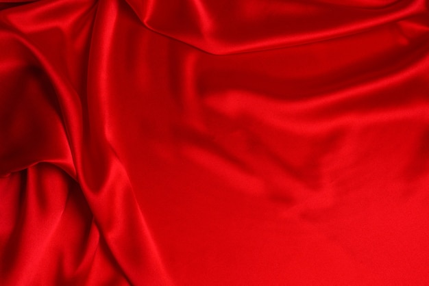 La Texture De Tissu De Luxe En Soie Rouge Ou En Satin Peut être Utilisée Comme Fond Abstrait. Vue De Dessus.