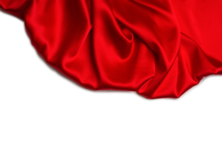 Photo la texture de tissu de luxe en soie rouge ou en satin peut être utilisée comme fond abstrait. vue de dessus