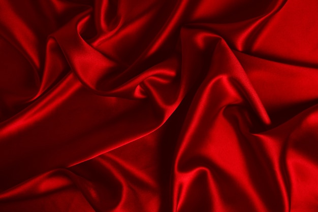 Texture de tissu de luxe en soie rouge ou satin