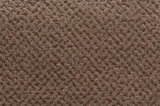 Texture de tissu marron clair avec des reliefs