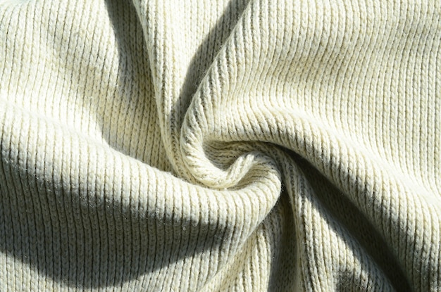 Texture de tissu d&#39;un pull tricoté jaune doux