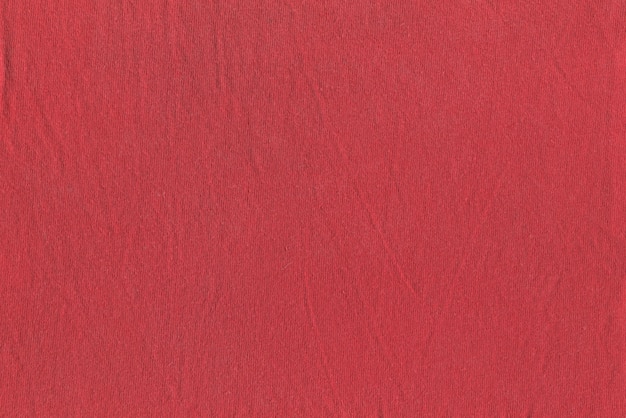 Texture de tissu rouge légèrement froissé