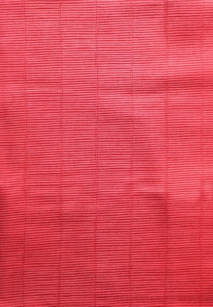 Photo texture de tissu rouge avec une surface inégale