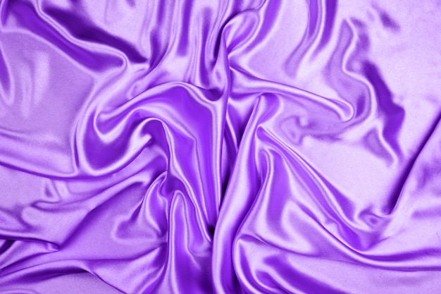 Texture de tissu satin de luxe violet pour le fond