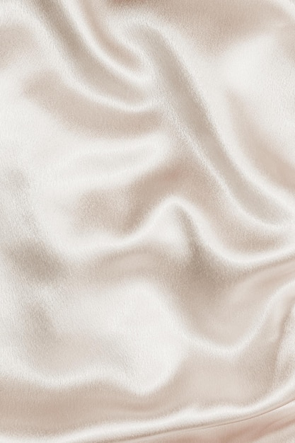 Texture de tissu de soie beige Mode satin Arrière-plan pour le contenu