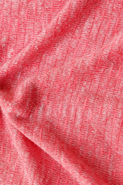 Texture de tissu tricoté rose sans couture avec un beau gros plan et un fond de détail de tissu élégant.