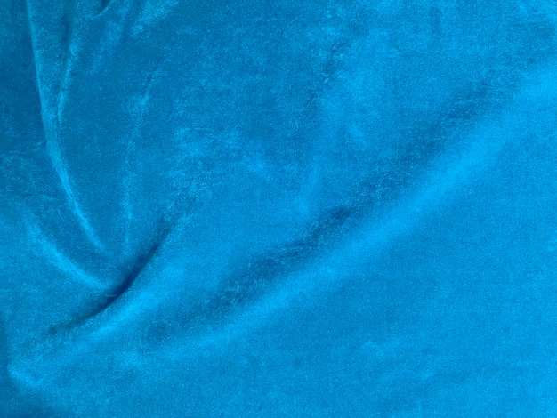 Texture de tissu de velours bleu clair utilisée comme arrière-plan Fond de tissu bleu clair vide de matière textile douce et lisse Il y a de l'espace pour le texte
