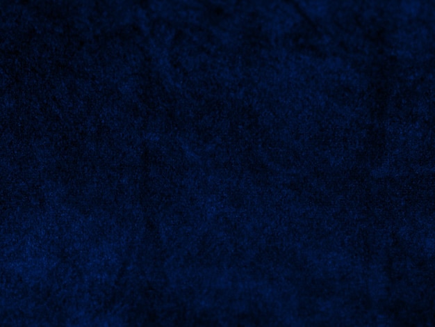 Texture de tissu de velours bleu foncé utilisé comme arrière-plan Fond de tissu bleu vide de matière textile douce et lisse Il y a de l'espace pour le texte