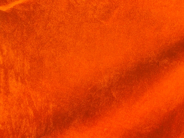 Texture de tissu de velours orange utilisée comme arrière-plan Fond de tissu orange vide de matière textile douce et lisse Il y a de l'espace pour textx9