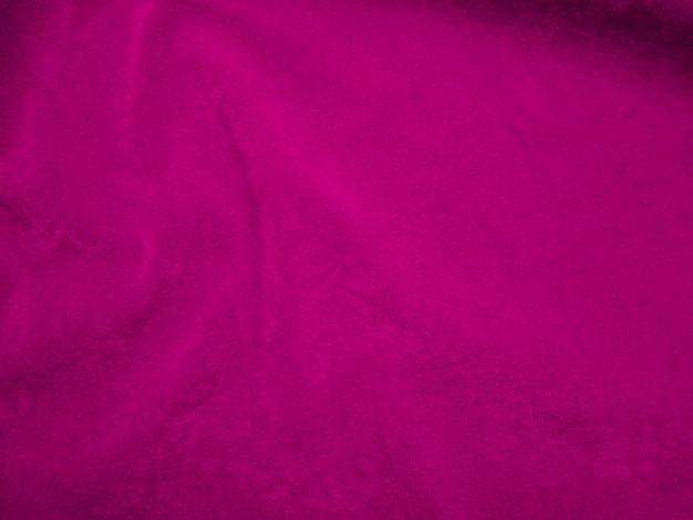 Photo texture de tissu de velours rose utilisée comme arrière-plan fond de tissu de panne de couleur vin de matériau textile doux et lisse ton magenta de luxe en velours écrasé pour la soie