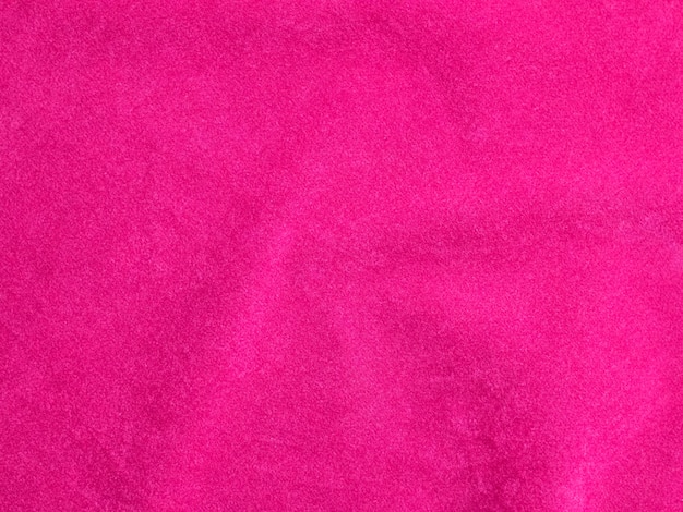 Texture de tissu de velours rose utilisée comme arrière-plan Fond de tissu rose vide de matière textile douce et lisse Il y a de l'espace pour le texte