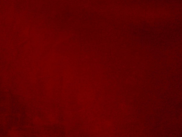 Texture de tissu de velours rouge utilisé comme arrière-plan Fond de tissu rouge vide de matière textile douce et lisse Il y a de l'espace pour le texte