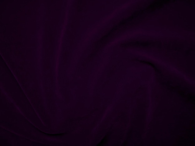 Texture de tissu de velours violet foncé utilisée comme arrière-plan Fond de tissu de panne de couleur violette de matériau textile doux et lisse ton magenta de luxe en velours écrasé pour la soie
