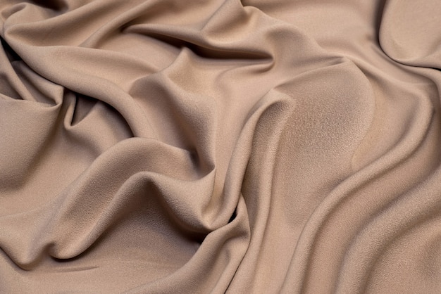 Texture de tissu en viscose marron. Fond, modèle.