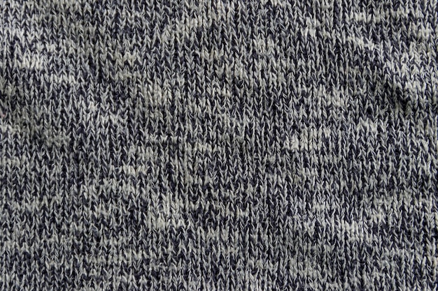 Texture tricot gris. Fond de tissu tricoté