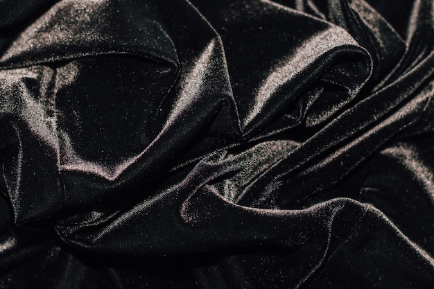 Texture de velours côtelé noir avec plis