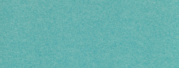 Texture de la vieille macro de fond de papier de couleur cyan Structure d'un carton turquoise artisanal vintage