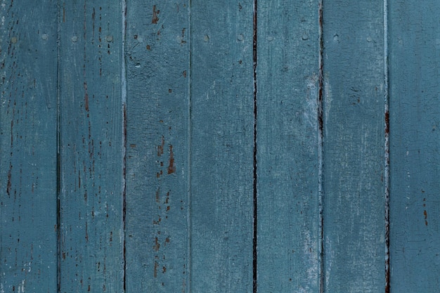 Texture de la vieille peinture bleue sur la surface en bois de la clôture avec des clous Élément de conception de l'espace vide