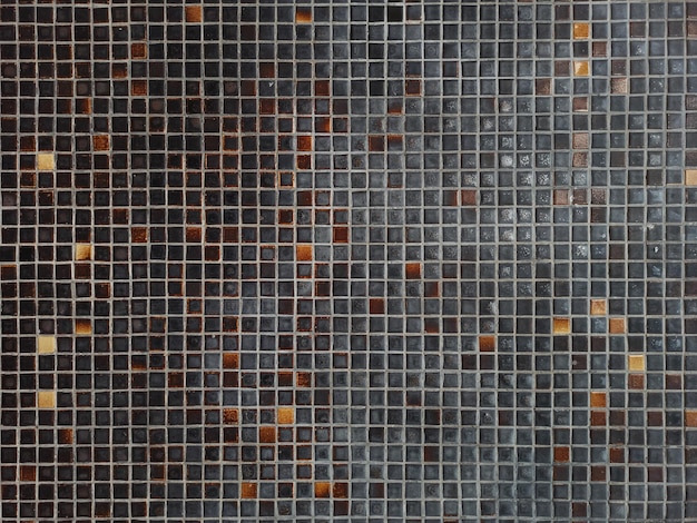 Texture des vieilles tuiles murales brunes noires et orange
