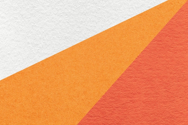 Texture de vieux métiers blanc orange et rouge couleur papier d'arrière-plan macro carton de gingembre vintage