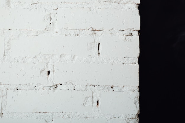 Texture d'un vieux mur de briques blanches et noires. Abstrait vintage