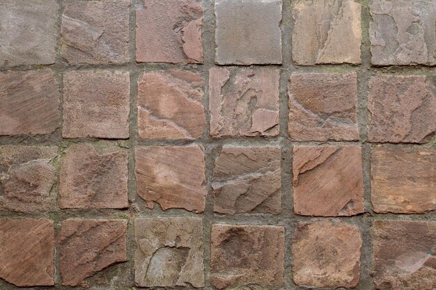 Texture de vieux pavés de granit brun