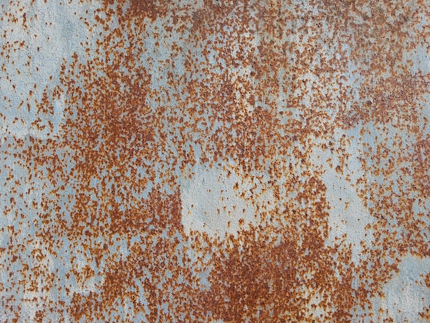 Texture vintage sur une surface métallique avec des traces de vieille peinture et de rouille