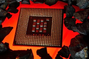 Photo the microprocessor from the computer lies on hot coals closeup