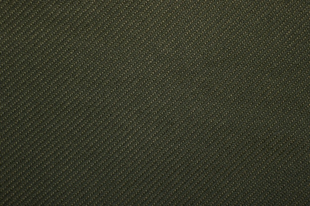 Tissu d'armure sergé vert motif texture fond gros plan