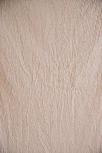 Tissu Beige Froissé Négligemment Comme Image D'arrière-plan Surface Inégale La Texture Du Tissu En Coton