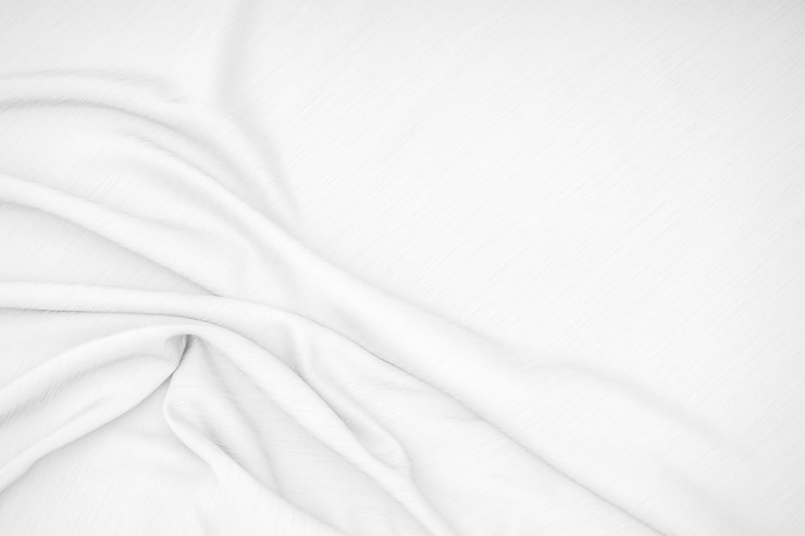 Photo tissu blanc, texture de tissu doux vagues.