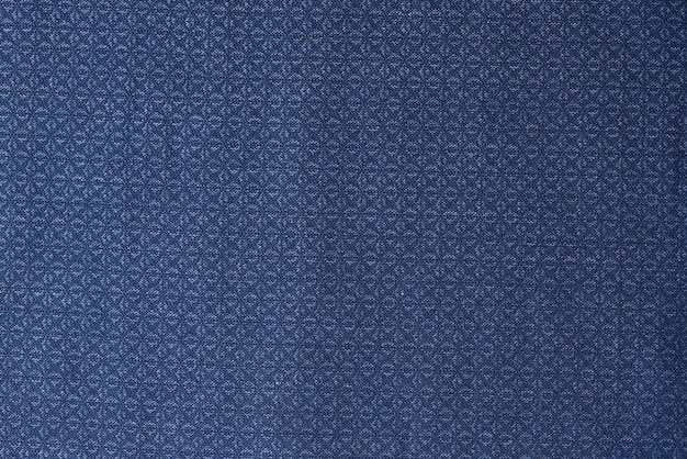 Tissu bleu avec motif géométrique comme arrière-plan textile bleu avec ornement gros plan