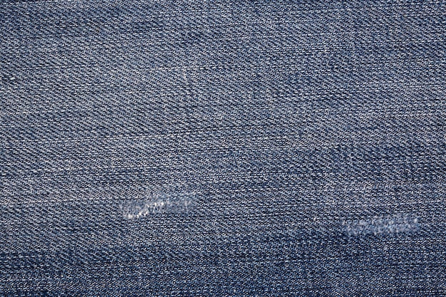 Tissu jean bleu. Texture de jeans en denim ou fond de jeans en denim.