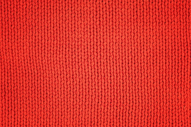 Tissu de laine tricoté rouge comme fond textile texture