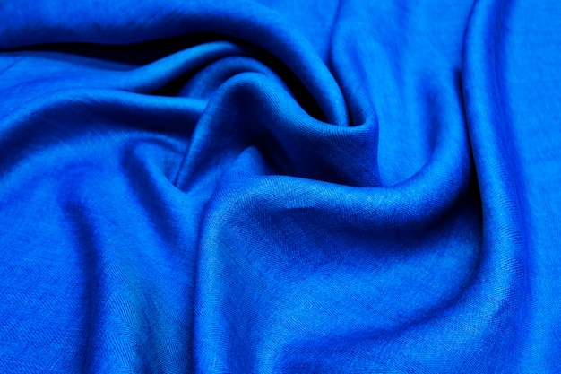 Tissu en lin denim fond bleu. Texture de tissu bleu lin froissé doux.