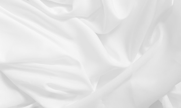 Tissu de lin lisse ondulation blanc flou sur fond de texture de détail