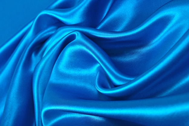 Photo tissu de satin bleu naturel comme texture de fond