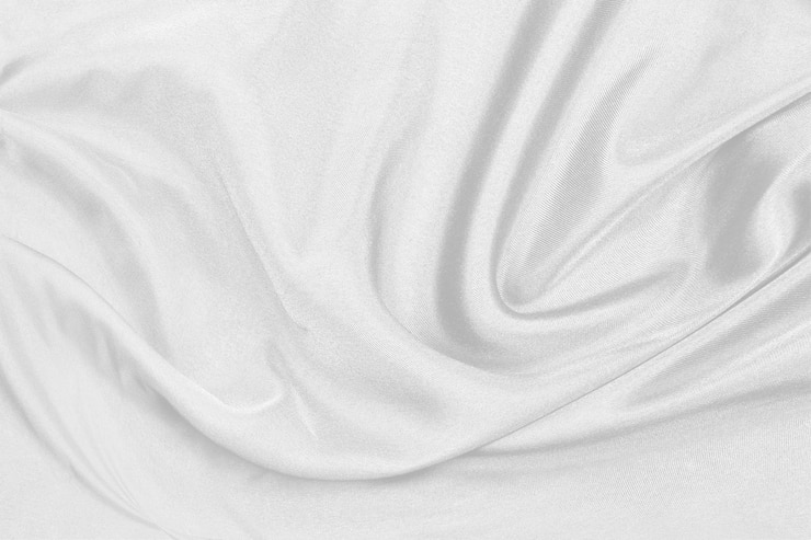 Photo un tissu de soie blanche élégant et lisse ou une texture de tissu de luxe en satin peuvent être utilisés comme arrière-plan de mariage. pour draperie luxueux design abstrait