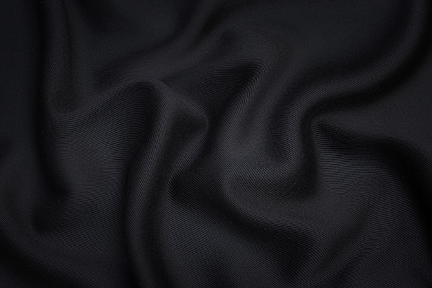 Tissu en soie ou en coton. Couleur gris foncé ou noir. Texture, arrière-plan, motif.