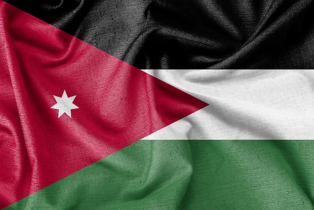 Photo tissu de soie réaliste de fond de drapeau de pays de la jordanie