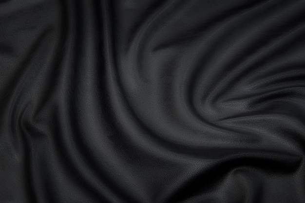 Tissu en tissu de cuir. Couleur gris foncé ou noir. Texture, arrière-plan, motif.