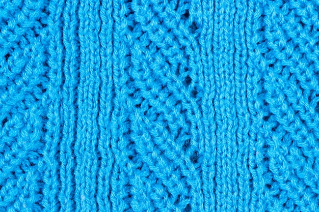 Tissu tricoté bleu avec tricot grossier. Texture et fond