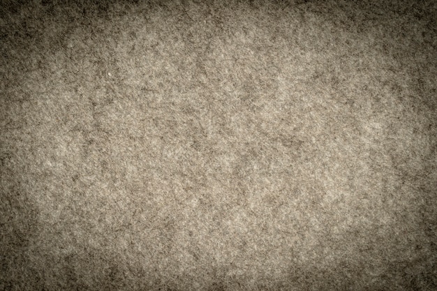 Photo tissu tricoté gris chiné fait de fibres synthétiques fond texturé. texture de tissu tricoté gris. fond avec motif rayé délicat, gros plan