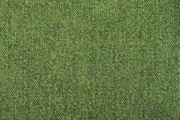 Photo tissu d'usine de texture de jeans de couleur verte sur fond blanc gros plan