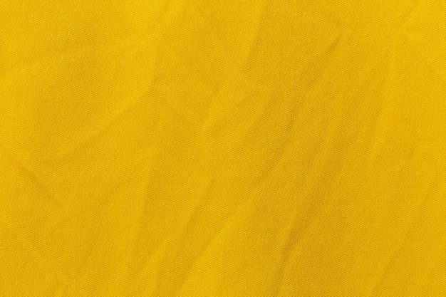 Tissu de vêtements de sport de couleur jaune texture de maillot de maillot de football et fond textile