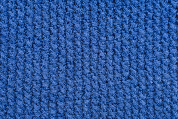 Tissus tricotés Arrière-plan d'un tissu tricoté Tissu bleu à rayures diagonales tricoté à la main Motif tricoté en arrière-plan
