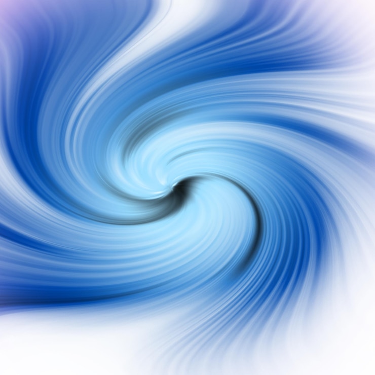 Photo un tourbillon bleu et blanc sur fond blanc.