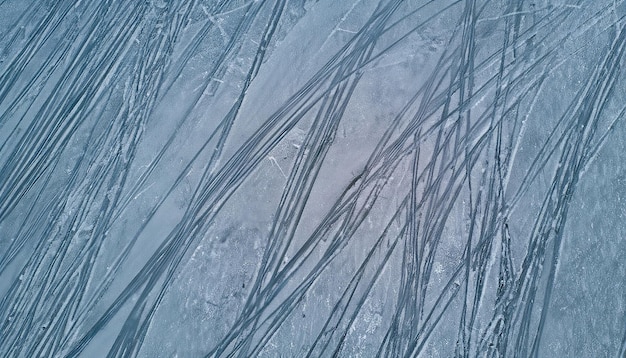 Photo traces de glace de patins texture arrière-plan abstrait vue de dessus traces de photographie aérienne